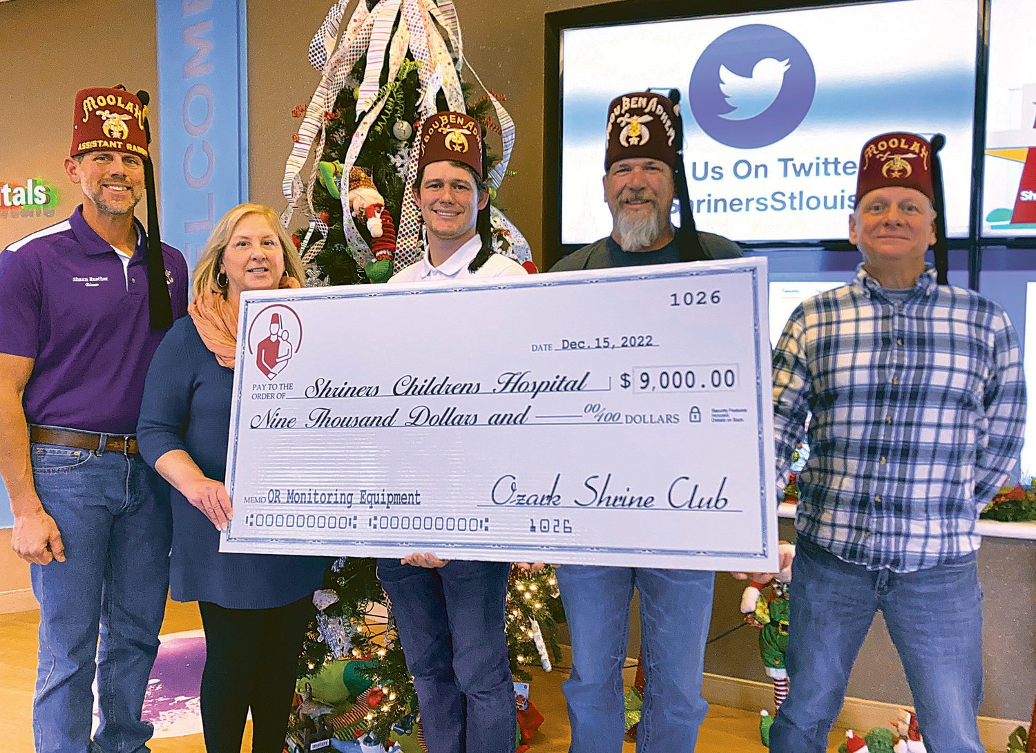 Ozark Shrine Club presented a $9,000 donation to St. Louis Shriners Hospital on Dec. 12. , From left, Shaun Reuther, Dianne Johnson (Shriners Hospital), John M. Behrens, Jeff Reynolds, and John A. Behrens.